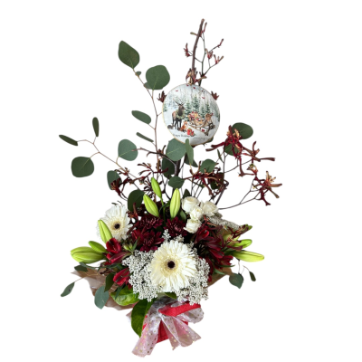Festive Cheer - A festive arrangement filled with holiday blooms and delivered in with a special f
keepsake Christmas Ornament , perfect for sending Christmas cheer.