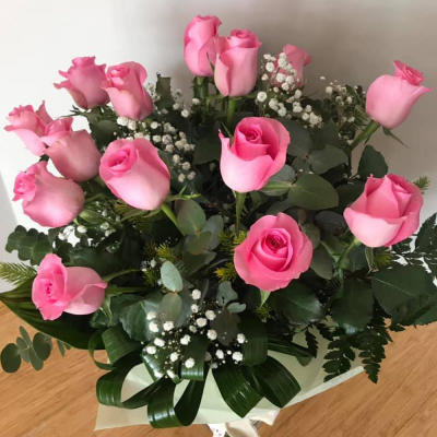 Rose Garden - A gorgeous handtied in water presented in a gif bag/box. Created using all pink roses with complimentary foliage. Hand delivered with care in and around Perth by Carramar Flowers & Gifts.